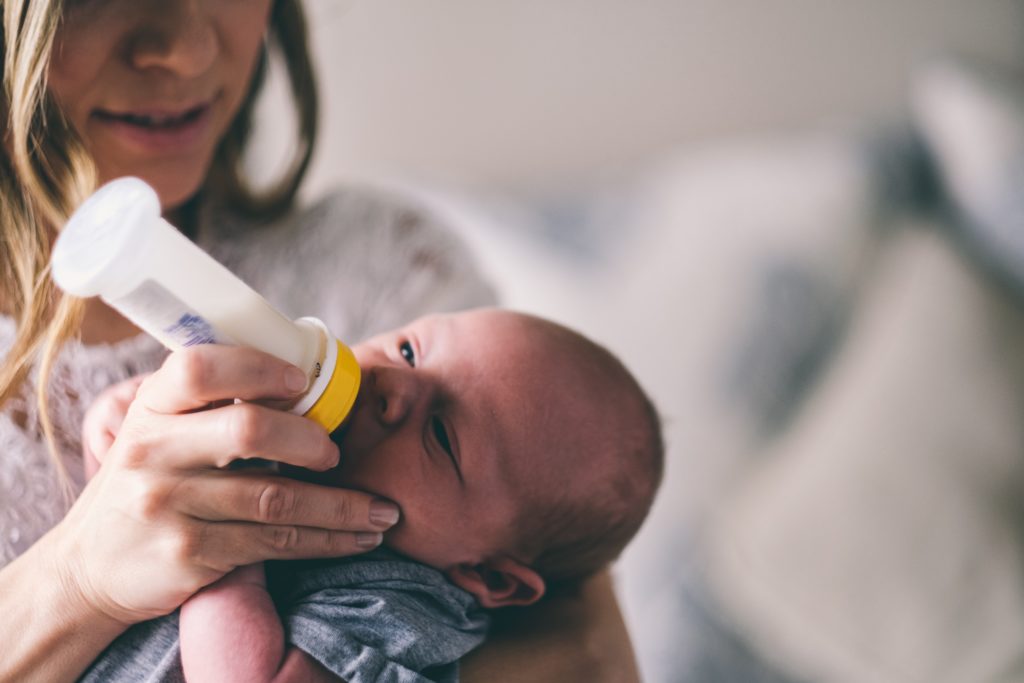bottle feeding a baby 